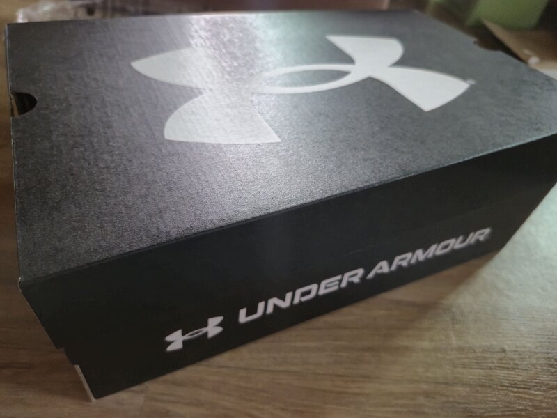 A black Under Armour shoe box.