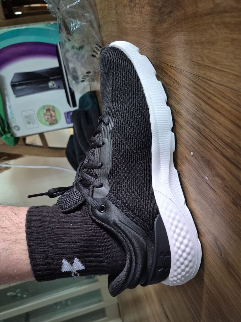 Photo of someone wearing Under Armour running shoes.